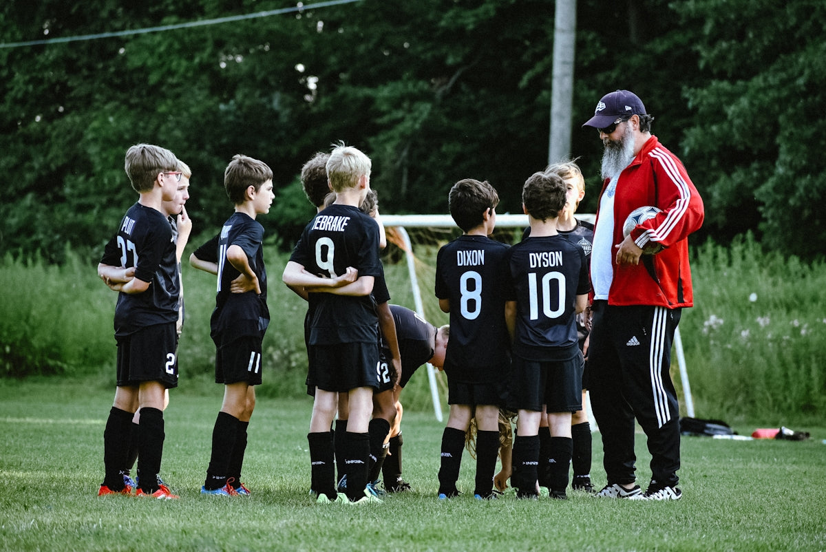 a group of boys in football uniforms